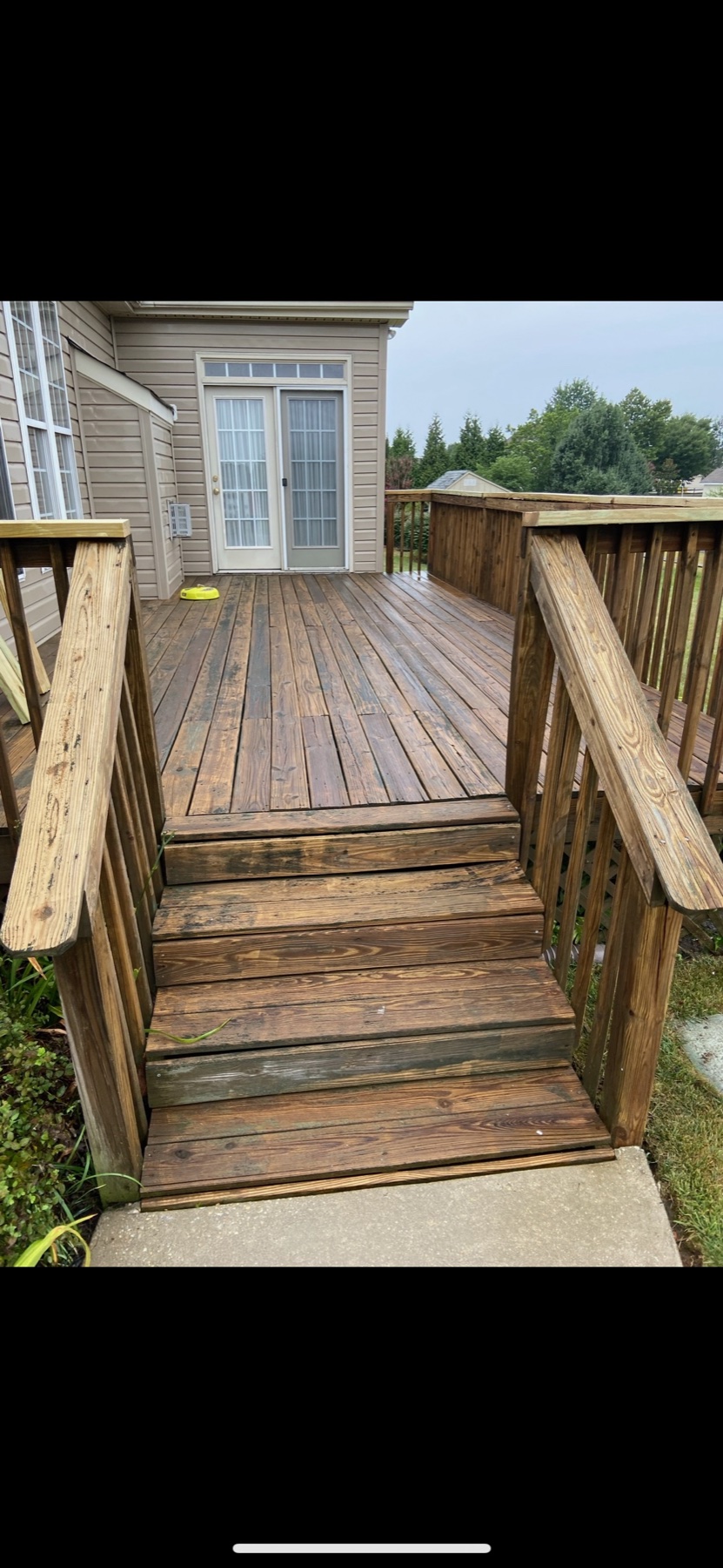 Restored and stained wooden deck and steps after cleaning