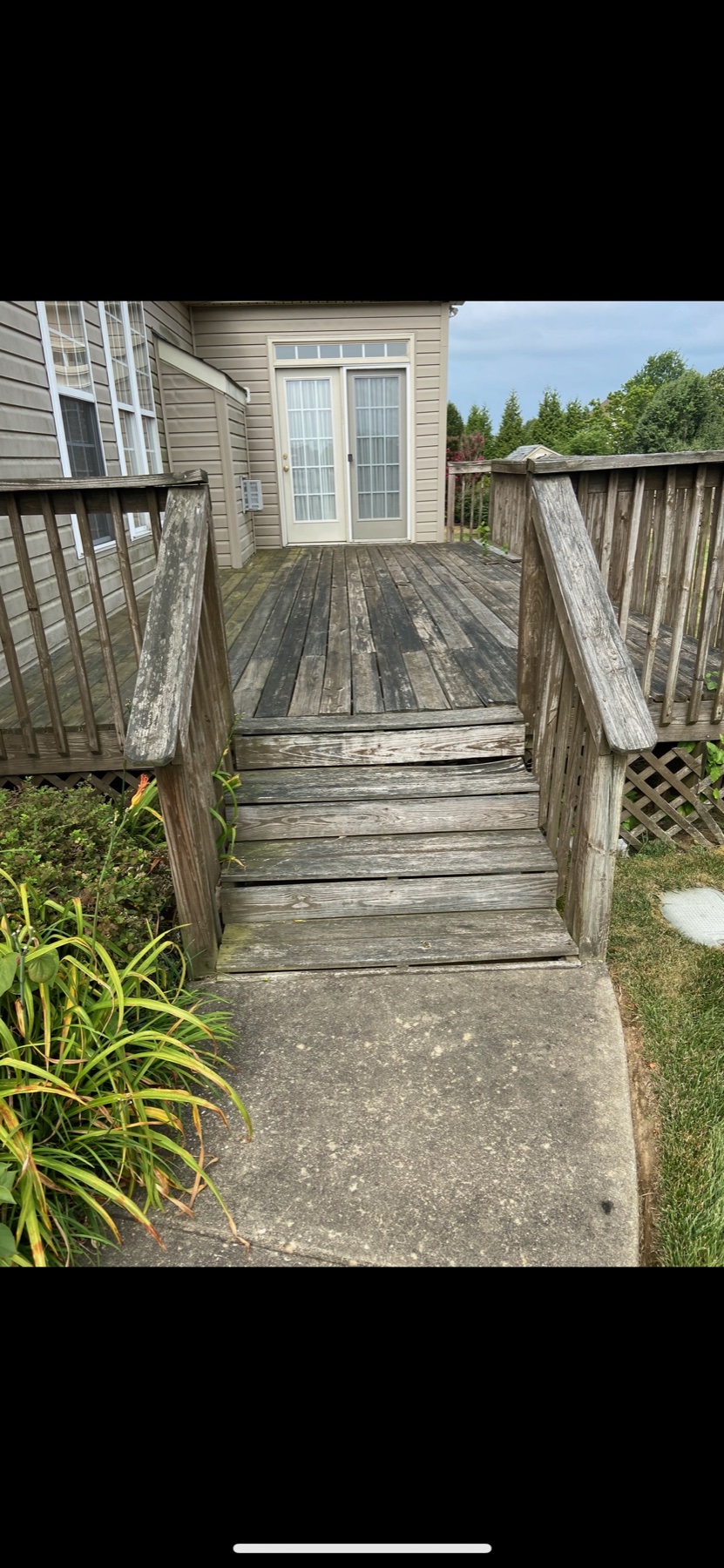 Weathered wooden deck and steps before restoration